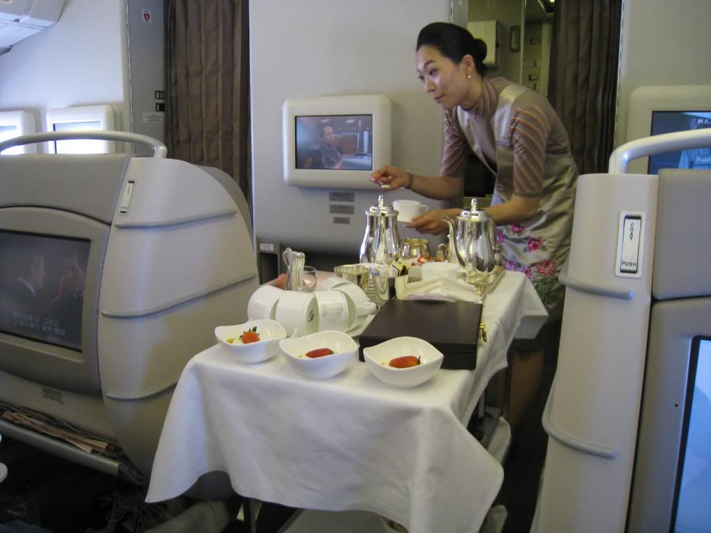 asiana flight attendant providing service